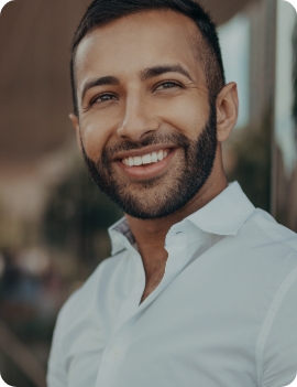 Smiling man in white button down shirt
